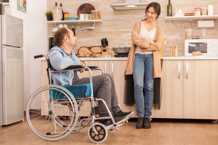 woman-smiling-disabled-husband-wheelchair-while-talking-with-him-disabled-paralyzed-handicapped-man-with-walking-disability-integrating-after-accident_482257-1